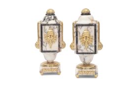 A PAIR OF ART DECO VEINED MARBLE AND GILT METAL GARNITURE ORNAMENTS