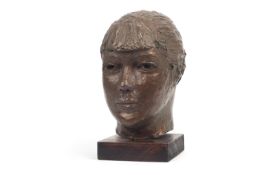 A 20TH CENTURY BRONZED PLASTER HEAD OF A GIRL IN THE MANNER OF JACOB EPSTEIN