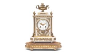 A LATE 19TH CENTURY FRENCH WHITE MARBLE AND GILT METAL MANTEL CLOCK