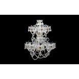A 19TH CENTURY STYLE CUT AND MOULDED GLASS CHANDELIER
