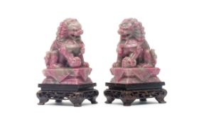 A SMALL PAIR OF CHINESE CARVED RHODONITE DOGS OF FO