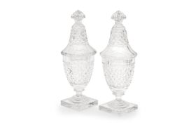 A PAIR OF EARLY 20TH CENTURY LEAD CRYSTAL GLASS URNS AND COVERS BY THOMAS WEBB