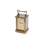 AN EARLY 20TH CENTURY FRENCH GILT BRASS CARRIAGE CLOCK