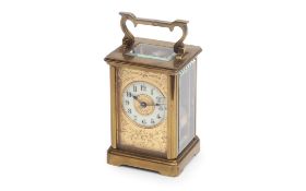 AN EARLY 20TH CENTURY FRENCH GILT BRASS CARRIAGE CLOCK