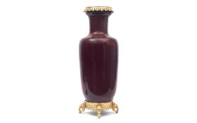 A LARGE RED GLASS BALUSTER VASE WITH ORMOLU MOUNTS