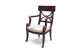 A 19TH CENTURY MAHOGANY AND PARCEL GILT ARMCHAIR IN THE MANNER OF THOMAS HOPE