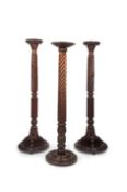 A PAIR OF 19TH CENTURY MAHOGANY PEDESTALS TOGETHER WITH ANOTHER