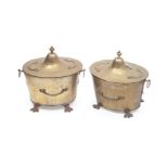 A PAIR OF 19TH CENTURY NEO-CLASSICAL STYLE HAMMERED BRASS LIDDED COAL BINS
