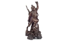 AN EARLY 20TH CENTURY JAPANESE CARVED HARDWOOD FIGURAL GROUP OF A WARRIOR AND DRAGON