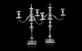 A PAIR OF GEORGIAN STYLE SILVER PLATED CANDELABRA