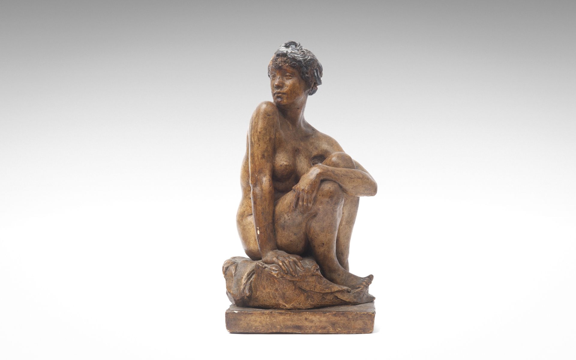SIR WILLIAM REID DICK R.A. (BRITISH, 1879-1961): A PLASTER MAQUETTE OF A SEATED NUDE