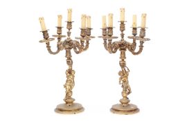 AFTER CORNEILLE VAN CLEVE: A PAIR OF 19TH CENTURY GILT BRONZE FIGURAL CANDELABRA