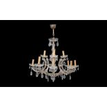 AN 18TH CENTURY STYLE CUT AND MOULDED GLASS TWELVE LIGHT CHANDELIER