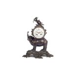 A LATE 19TH CENTURY FRENCH PATINATED BRONZE ELEPHANT MANTEL CLOCK