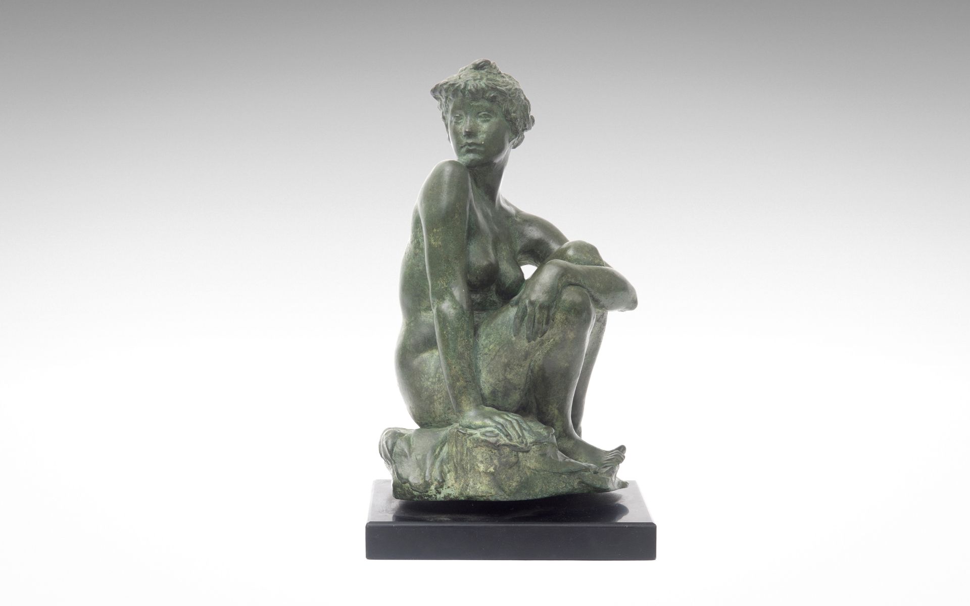 SIR WILLIAM REID DICK R.A. (BRITISH, 1879-1961): A BRONZE FIGURE OF A SEATED NUDE