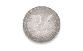 A SILVER COIN COMMEMORATING THE FIRST FLIGHT OF CONCORDE, JANUARY 21ST, 1976