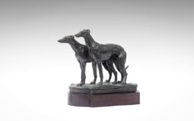 SIR WILLIAM REID DICK R.A. (BRITISH, 1879-1961): A BRONZE GROUP OF TWO GREYHOUNDS