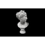 AFTER ANTONIO CANOVA (1757-1824): A 19TH CENTURY MARBLE BUST OF THE VENUS ITALICA