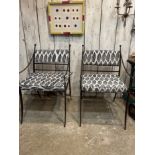 A PAIR OF IRON GARDEN CHAIRS WITH CUSHIONS