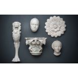 A COLLECTION OF FIVE WALL MOUNTED PLASTER RELIEFS