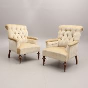 A PAIR OF 19TH CENTURY BUTTON BACK ARMCHAIRS