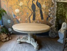 A LATE19TH CENTURY FRENCH BOOK-MATCHED OAK BREAKFAST TABLE