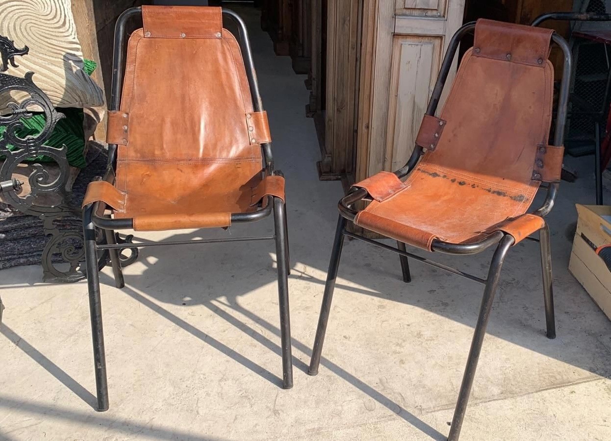 A PAIR OF LES ARCS STYLE LEATHER AND METAL CHAIRS