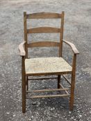 AN EARLY 20TH CENTURY ASH LADDER BACK CHAIR