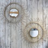 A PAIR OF DECORATIVE MIRRORS FORMED FROM HAY THRESHERS