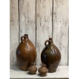 A COLLECTION OF FOUR 18TH CENTURY GERMAN STONEWARE JUGS