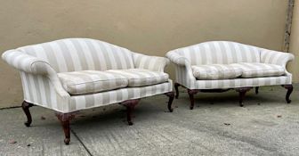 A PAIR OF IRISH MAHOGANY CAMEL BACK SOFAS