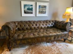 A BUTTON BACK LEATHER UPHOLSTERED CHESTERFIELD SOFA