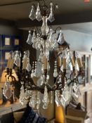 AN 18TH CENTURY STYLE METAL AND CUT GLASS CHANDELIER