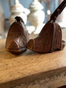 A PAIR OF CARVED WOOD CHILEAN RIDING STIRRUPS