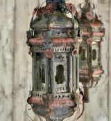 A PAIR OF ITALIAN BAROQUE STYLE PAINTED METAL LANTERNS