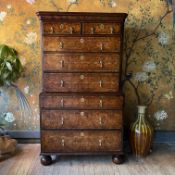 A QUEEN ANNE OYSTER VENEERED CHEST ON CHEST
