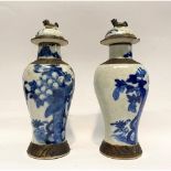 A PAIR OF CHINESE BLUE AND WHITE CRACKLE GLAZED VASES AND COVERS