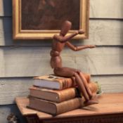 A SMALL TURNED WOOD ARTISTS LAY FIGURE