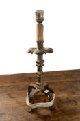 A 19TH CENTURY IRON CANDLESTICKS ADAPTED AS A LAMP BASE