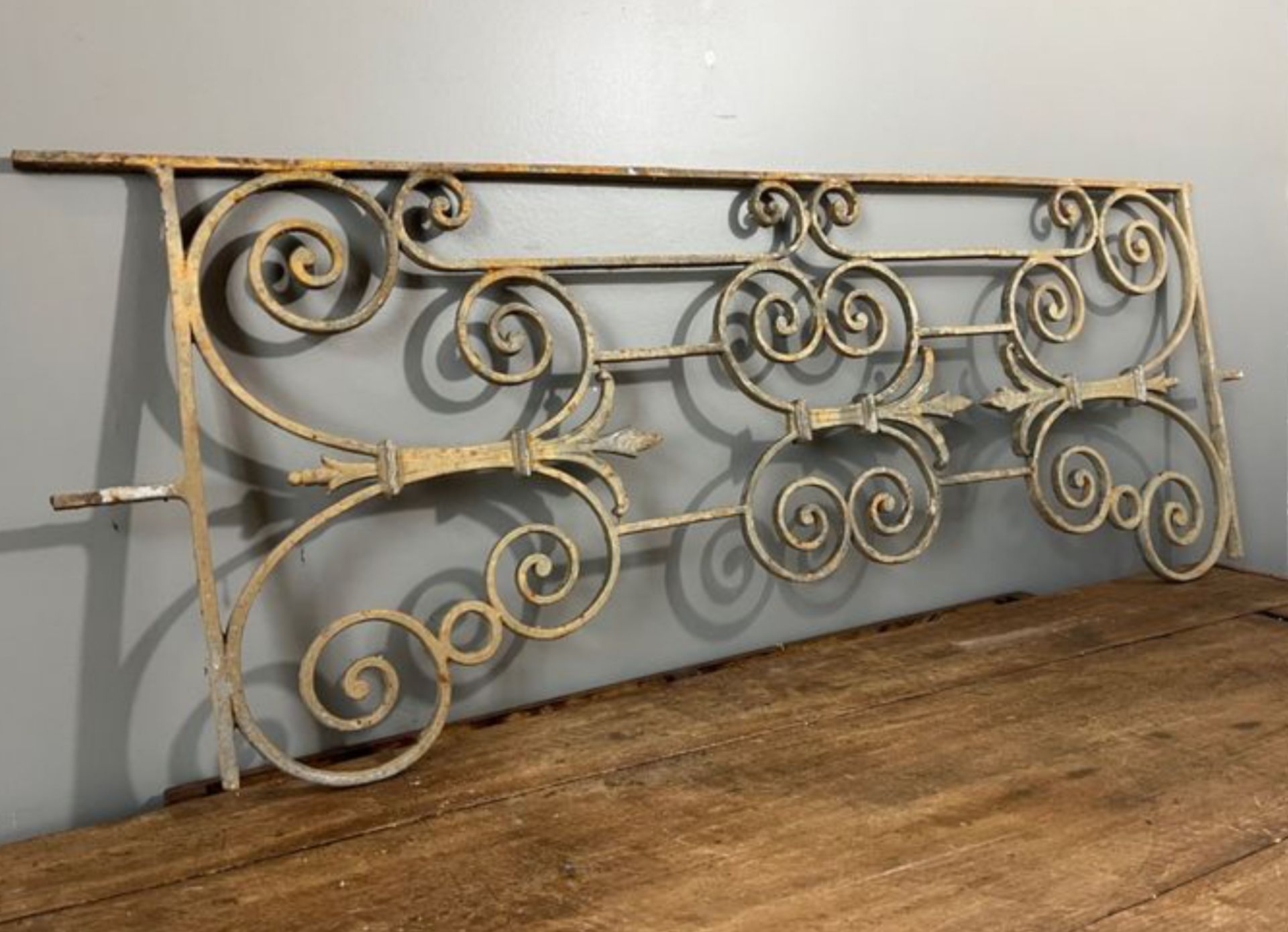 A PAIR OF FRENCH WROUGHT IRON BALCONY PANELS