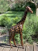 A PAINTED LEATHER MODEL OF A GIRAFFE
