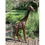 A PAINTED LEATHER MODEL OF A GIRAFFE