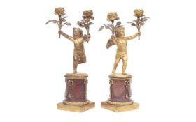 A PAIR OF 19TH CENTURY FRENCH GILT BRONZE AND MARBLE CHERUB CANDELABRA