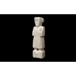 A SOUTH ARABIAN ALABASTER FIGURE OF A STANDING MALE