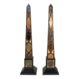 A LARGE PAIR OF FLOOR STANDING ROMAN STYLE SPECIMEN MARBLE OBELISKS