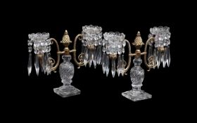 A PAIR OF REGENCY ORMOLU AND CUT GLASS CANDELABRA