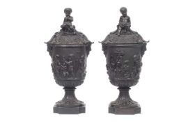 A PAIR OF 19TH CENTURY FRENCH BRONZE CLASSICAL LIDDED URNS