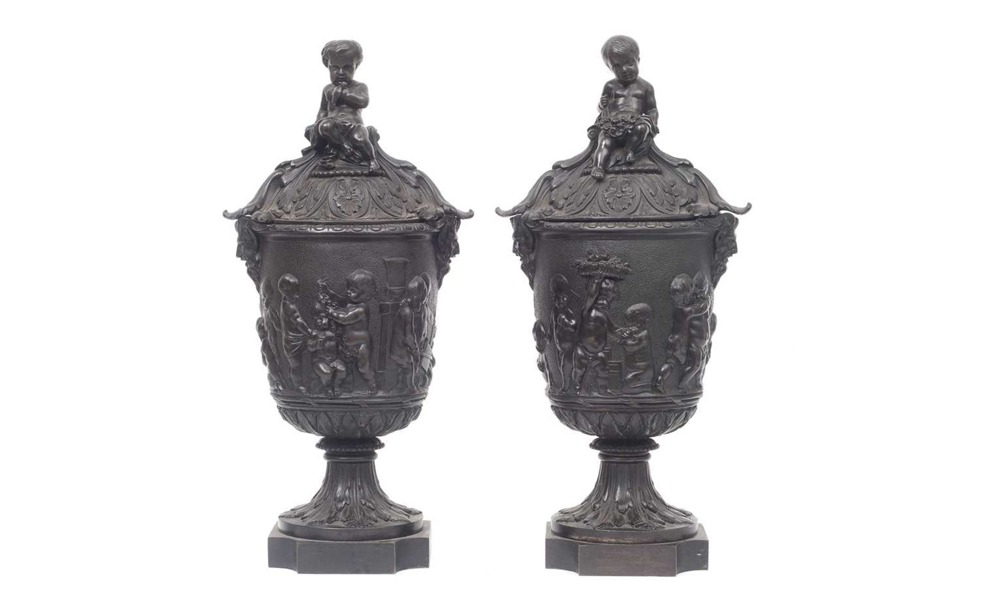 A PAIR OF 19TH CENTURY FRENCH BRONZE CLASSICAL LIDDED URNS