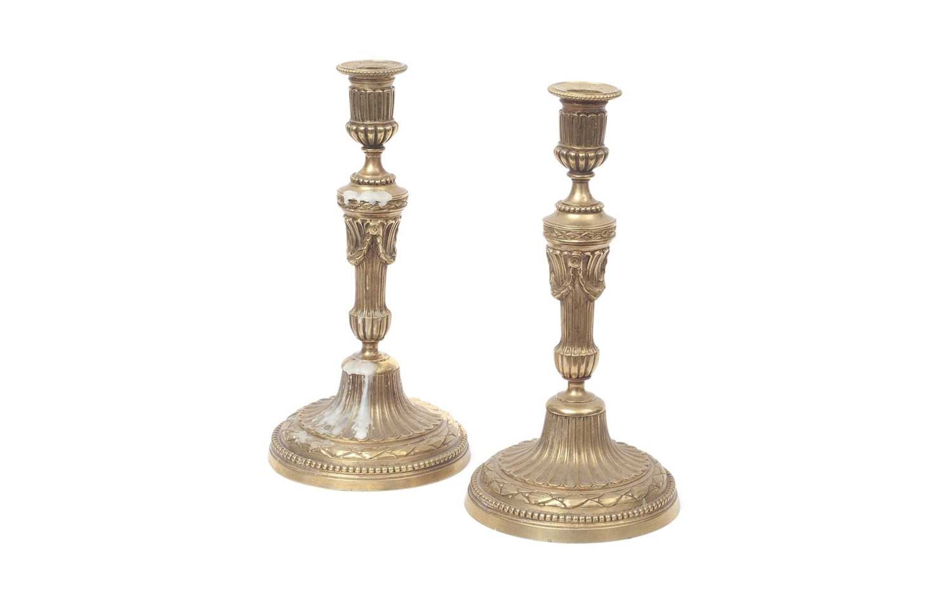 A PAIR OF 19TH CENTURY FRENCH GILT BRONZE CANDLESTICKS
