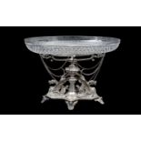 A 19TH CENTURY SILVER PLATED AND CUT GLASS CENTREPIECE